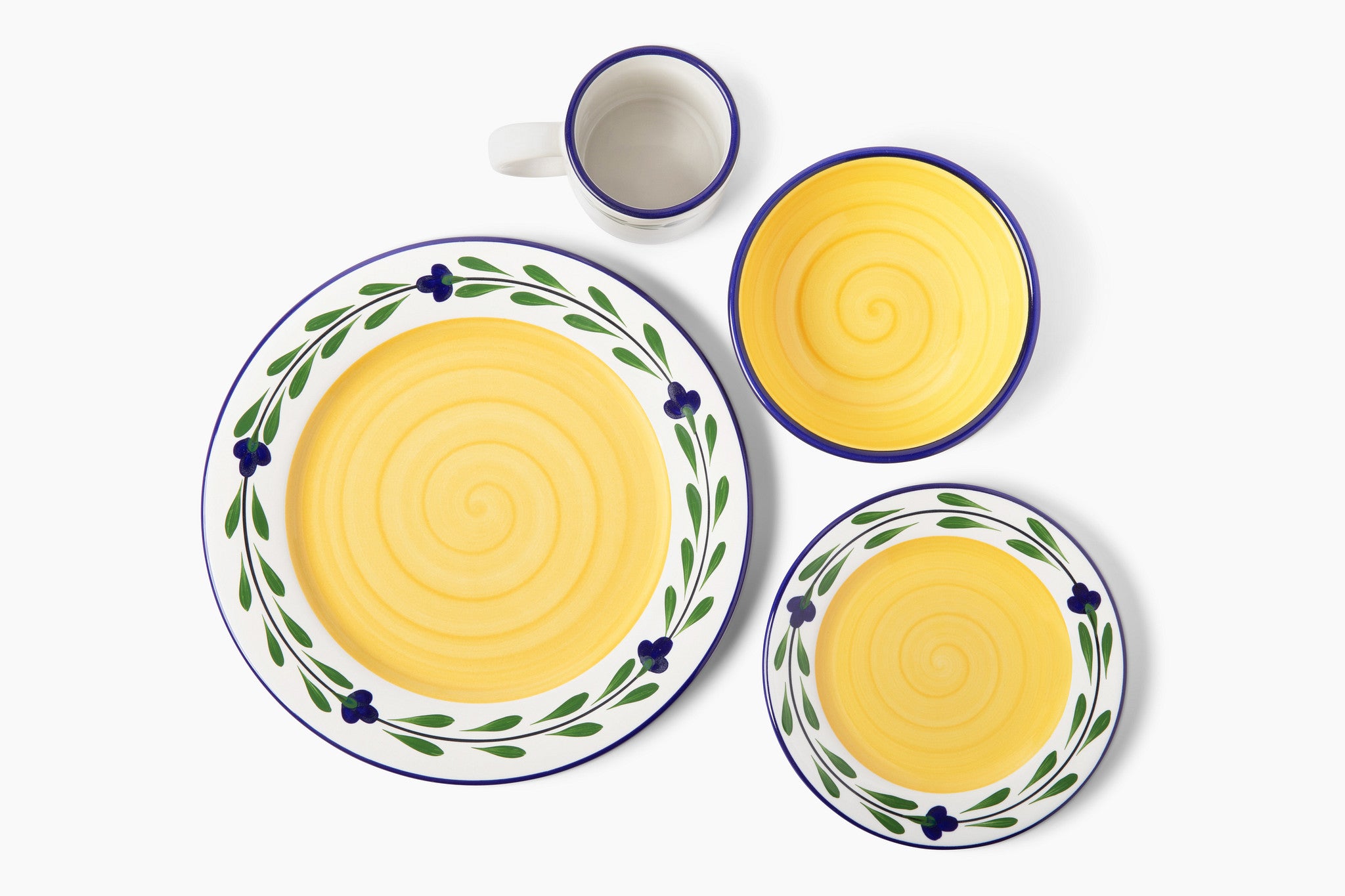 Hand-painted ceramic tableware set with yellow center and decorative edges on a white background. Set Contains Dinner plate, Salad/Dessert plate, cereal bowl, and mug.