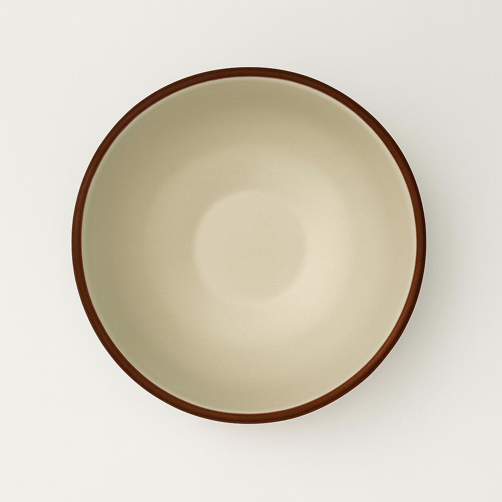 White ceramic bowl with earth-brown rim on a white background