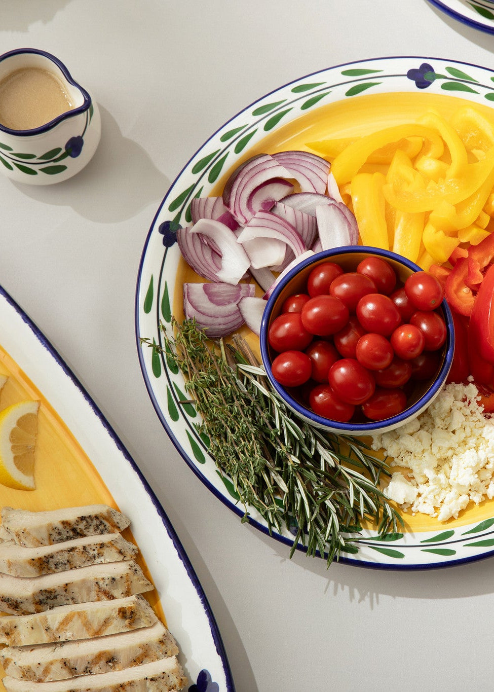 HF Coors Bella Flora large round serving platter with fresh veggies next to several other plates of food. All hand-painted and made in USA