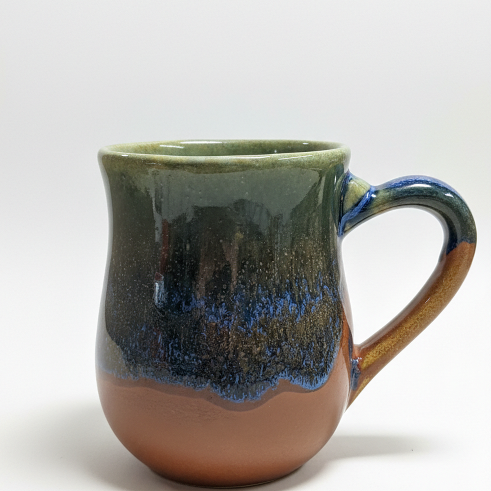 HF Coors Blue Bayou reactive glaze 15oz ceramic mug on white background showing sage green navy blue and terracotta glaze handcrafted in Tucson Arizona USA