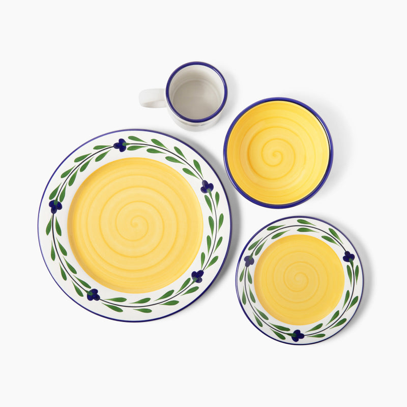Bella Flora dinnerware with yellow centers and blue and green floral borders